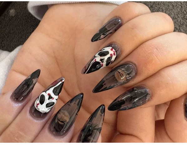 Black smoky stiletto nails with character art