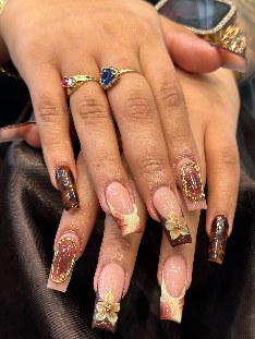 Pink and gold sculpted coffin nails