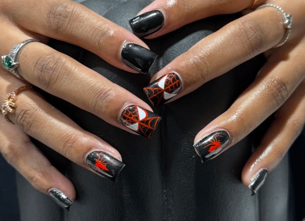 Black and orange spiderweb Halloween nails