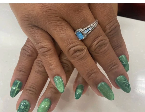 Emerald green chrome almond nails