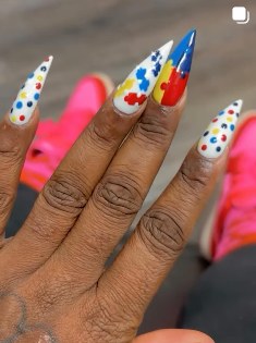 Bold red, blue and yellow pop-art stiletto nails